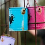 Tin cans with hearts on the fence