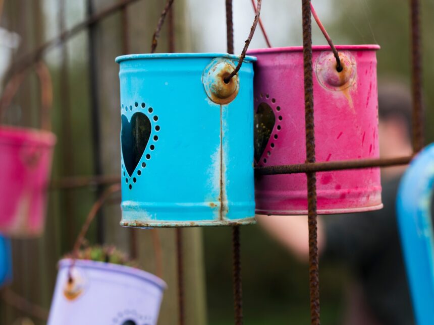 Tin cans with hearts on the fence
