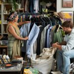 Two young consumers in thrift shop