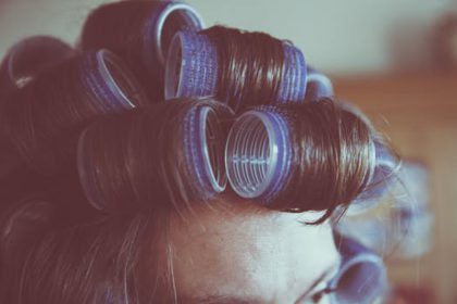 Use heated curlers to achieve defined, voluminous curls that last longer